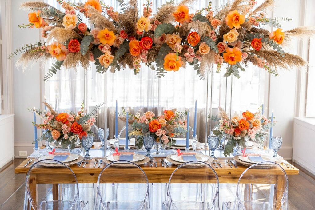 orange tropical wedding colors in floral arrangement