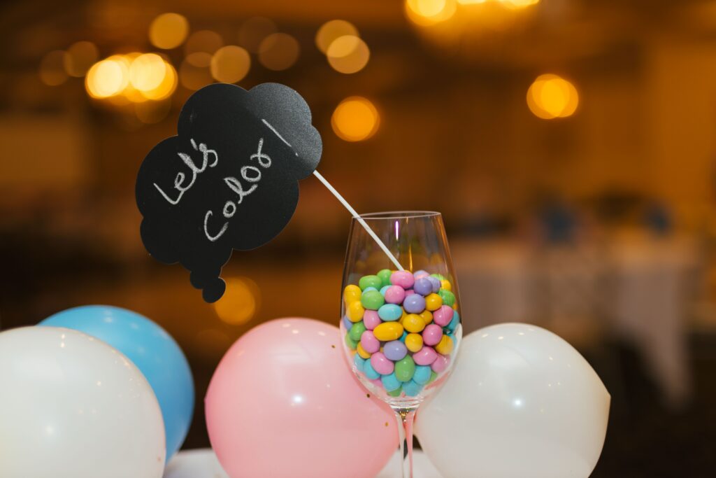 Photobooth sign, in a cup of candy at a wedding