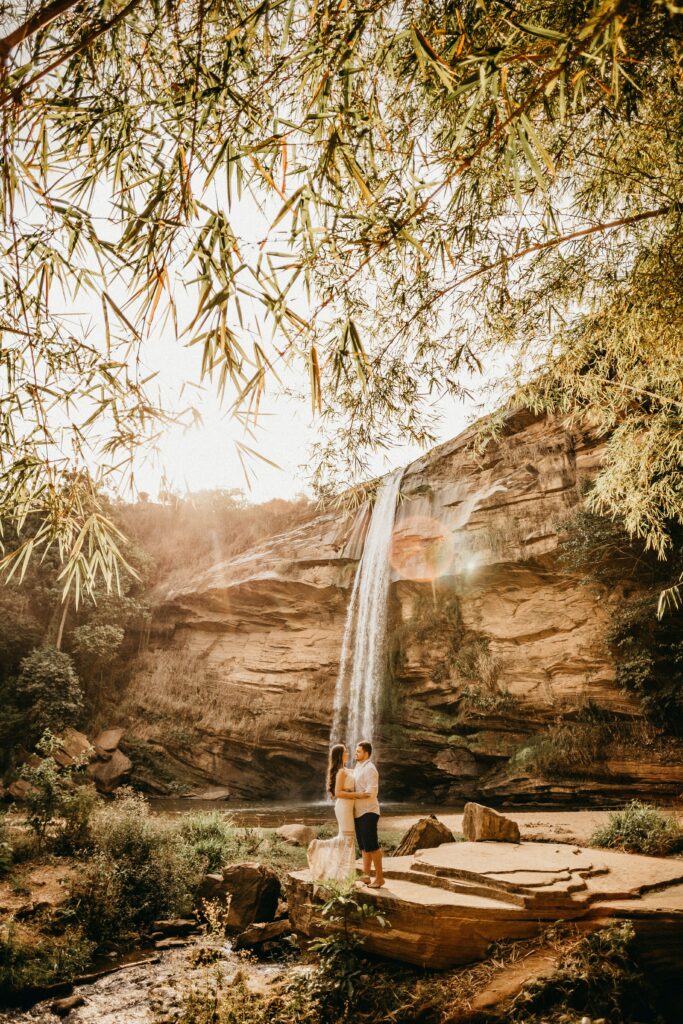 bride and groom, under a waterfall, destination wedding