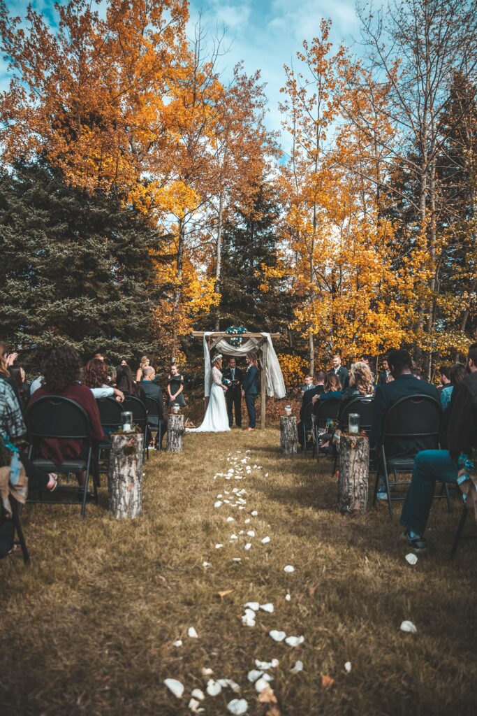 fall wedding outside, fall leaves, bride and groom