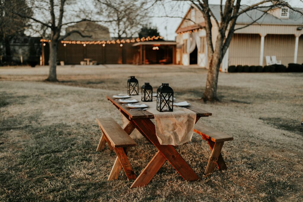wedding seating, picnic table, lights, burlap
